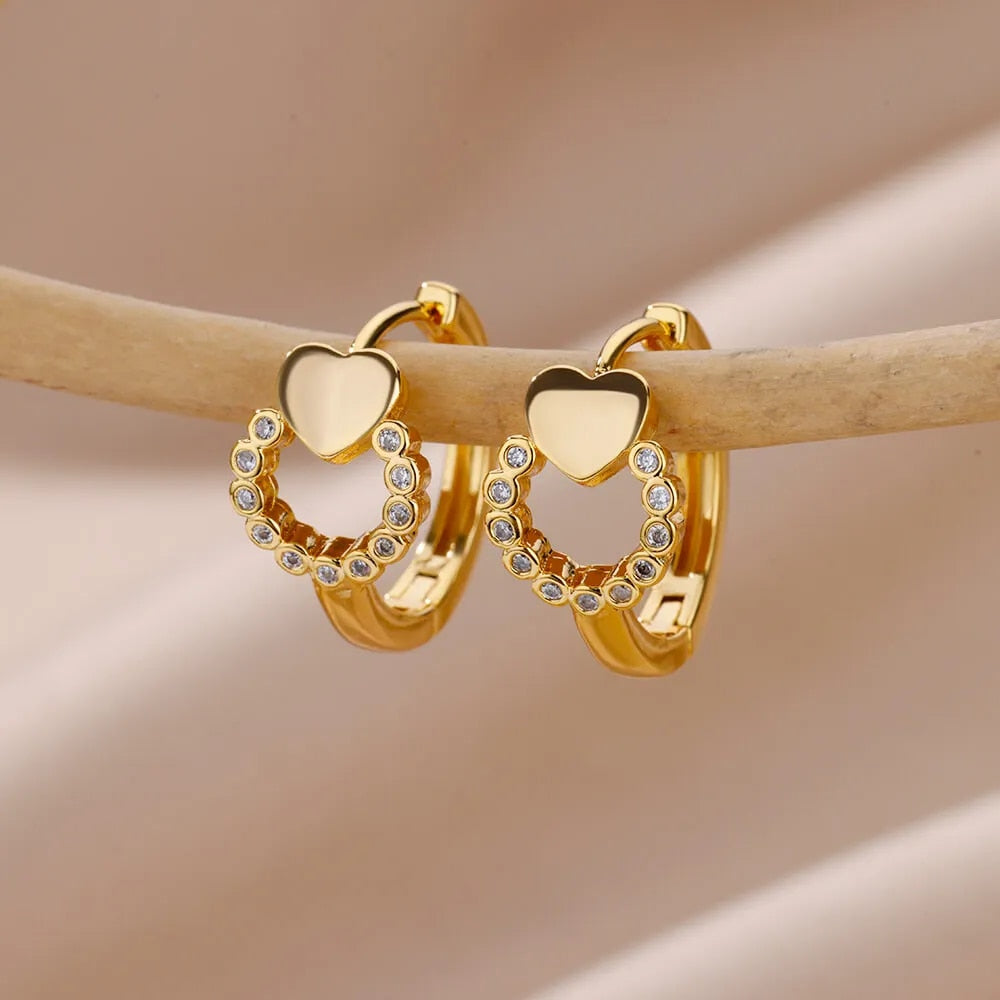 Gilded Whispers: Embracing Subtle Glamour with Petite Gold Heart Hoops