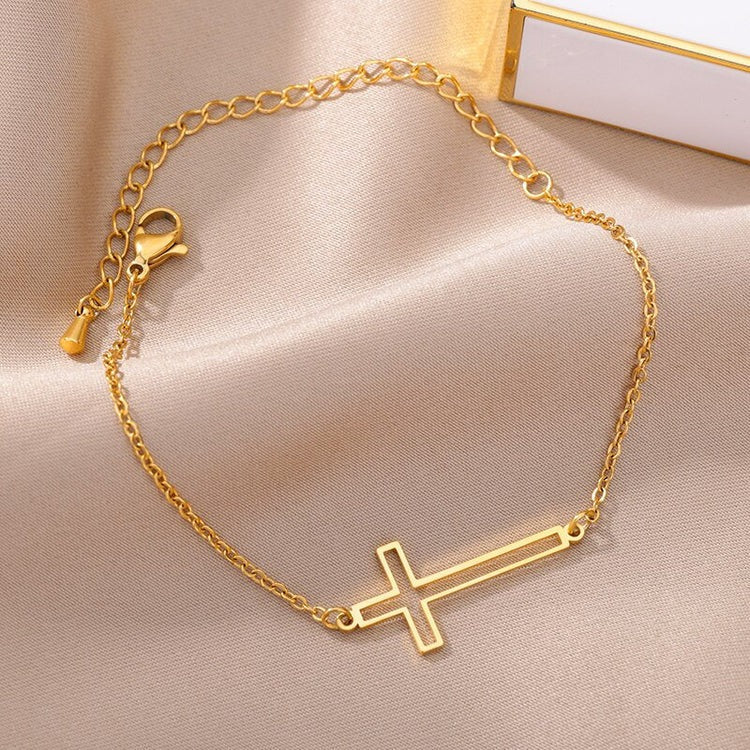 Graceful Reverence: Adorn Your Wrist with Our Gold Dainty Cross Bracelet Collection