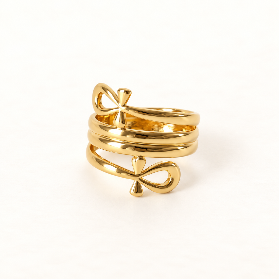 A gold ankh cross ring with Egyptian symbol design featuring looped top and horizontal bar, open adjustable band, shown from front and side angles on a clean white background displaying the ancient hieroglyphic symbol, spiritual significance, and polished gold finish.