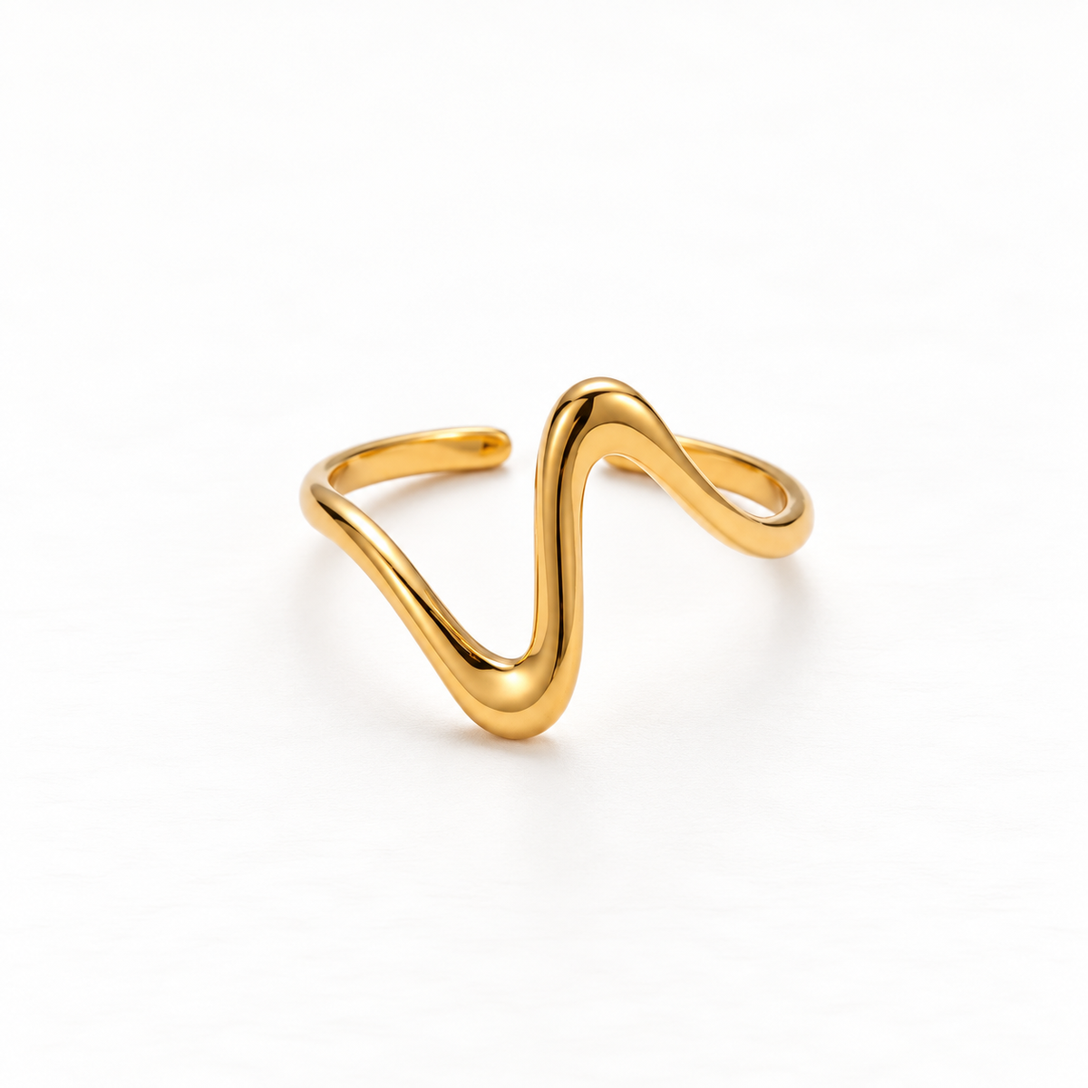 A gold wave heartbeat ring with zigzag pulse line design and smooth curved peaks, open adjustable band with organic fluid shape, shown from front and side angles on a clean white background displaying the rhythmic line pattern, sculptural wave form, and polished gold finish.