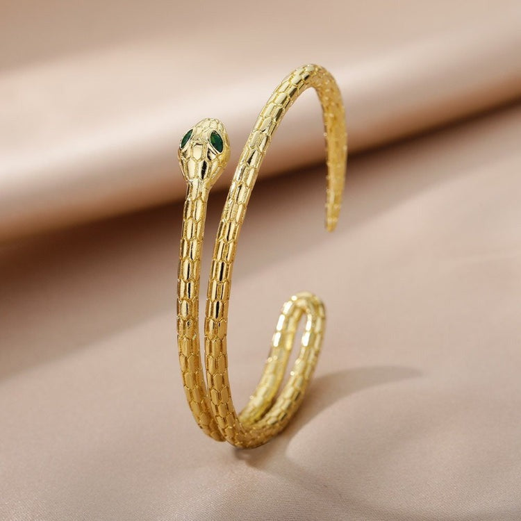 Embrace the Allure of the Gold Snake Bangle by Jacques Eclat
