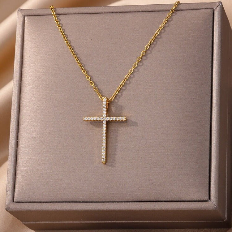 Celestial Whispers: Drape in Dainty Radiance with Our Crystal Cross Statement Necklace Collection