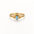 A gold aquamarine teardrop ring with pear-shaped blue stone in vintage-inspired milgrain setting, delicate beaded band detail and scalloped edges, open adjustable design, shown from front and side angles on a clean white background displaying the soft blue hue, intricate metalwork, and polished gold finish.
