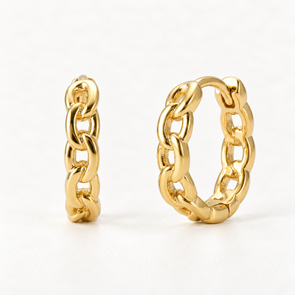 A pair of 18k gold chain-link huggie hoop earrings with interlocking oval chain pattern, shown from front and side angles on a clean white background displaying the detailed link texture and hinged closure.