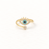 A gold crown evil eye ring with regal tiara detail above, turquoise blue center stone surrounded by clear crystals, and floral star accent below, open adjustable band, shown from front and side angles on a clean white background displaying the protective royal symbolism, intricate stone setting, and polished gold finish.