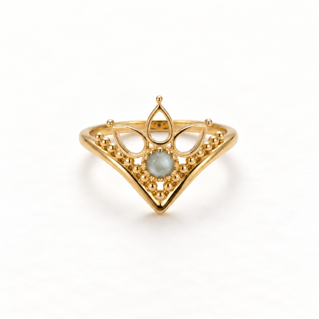 A gold crown tiara ring with intricate filigree details and iridescent moonstone center, regal princess design with pointed peaks and delicate metalwork, open adjustable band, shown from front and side angles on a clean white background displaying the royal symbolism, ornate lace-like texture, and polished gold finish.