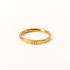 A gold angel number ring with "777" engraved on the band, slim minimalist design with etched numerals, shown from front and side angles on a clean white background displaying the spiritual luck symbol, delicate band, and polished gold finish.