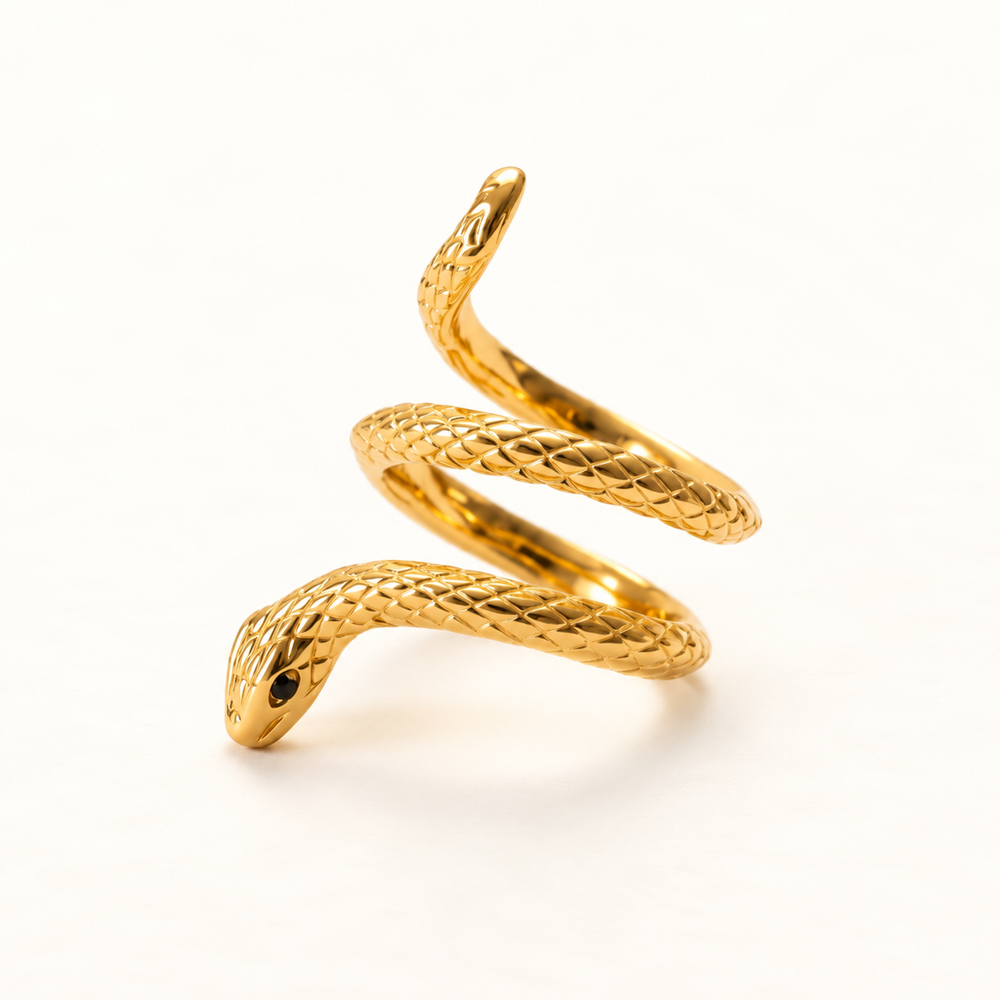 A gold snake wrap ring with detailed scale texture and coiled serpent body wrapping around the finger, open adjustable design with head and tail visible, shown from front and side angles on a clean white background displaying the intricate scale pattern, serpentine form, and polished gold finish with black eye detail.