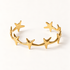 A gold star cuff bracelet with multiple five-point stars forming an open celestial band, shown from front and side angles on a clean white background displaying the polished star shapes, open cuff design, and cosmic constellation aesthetic.