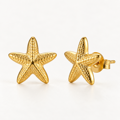 A pair of 18k gold starfish-shaped stud earrings with textured surface detail and five points, shown from front and side angles on a clean white background displaying the organic sea-inspired texture and post with butterfly backing.