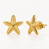 A pair of 18k gold starfish-shaped stud earrings with textured surface detail and five points, shown from front and side angles on a clean white background displaying the organic sea-inspired texture and post with butterfly backing.