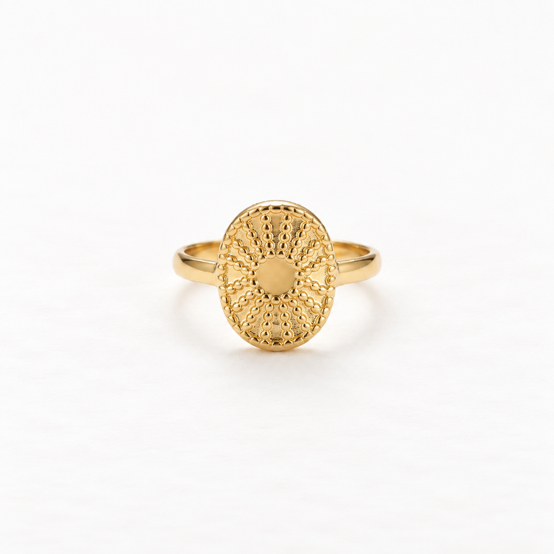 A gold sun coin filigree ring with intricate radiating pattern and smooth polished center, detailed metalwork sunburst design, open adjustable band, shown from front and side angles on a clean white background displaying the ornate celestial symbolism, delicate ray texture, and polished gold finish.