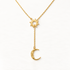 A gold sun and moon Y necklace with radiating sun pendant at chest and dangling crescent moon on chain drop, celestial lariat design with cable chain, shown from front and side angles on a clean white background displaying the anthropomorphic sun face, textured moon detail, and polished gold finish.
