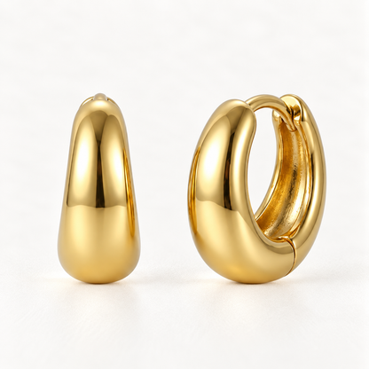 A pair of 18k gold teardrop dome huggie hoop earrings with sleek polished elongated oval profile, shown from front and side angles on a clean white background displaying the smooth reflective surface and hinged closure.