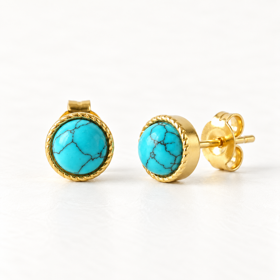 A pair of 18k gold round stud earrings with blue turquoise cabochon centers and rope twist borders, shown from front and side angles on a clean white background displaying the vibrant natural stone veining and post with butterfly backing.